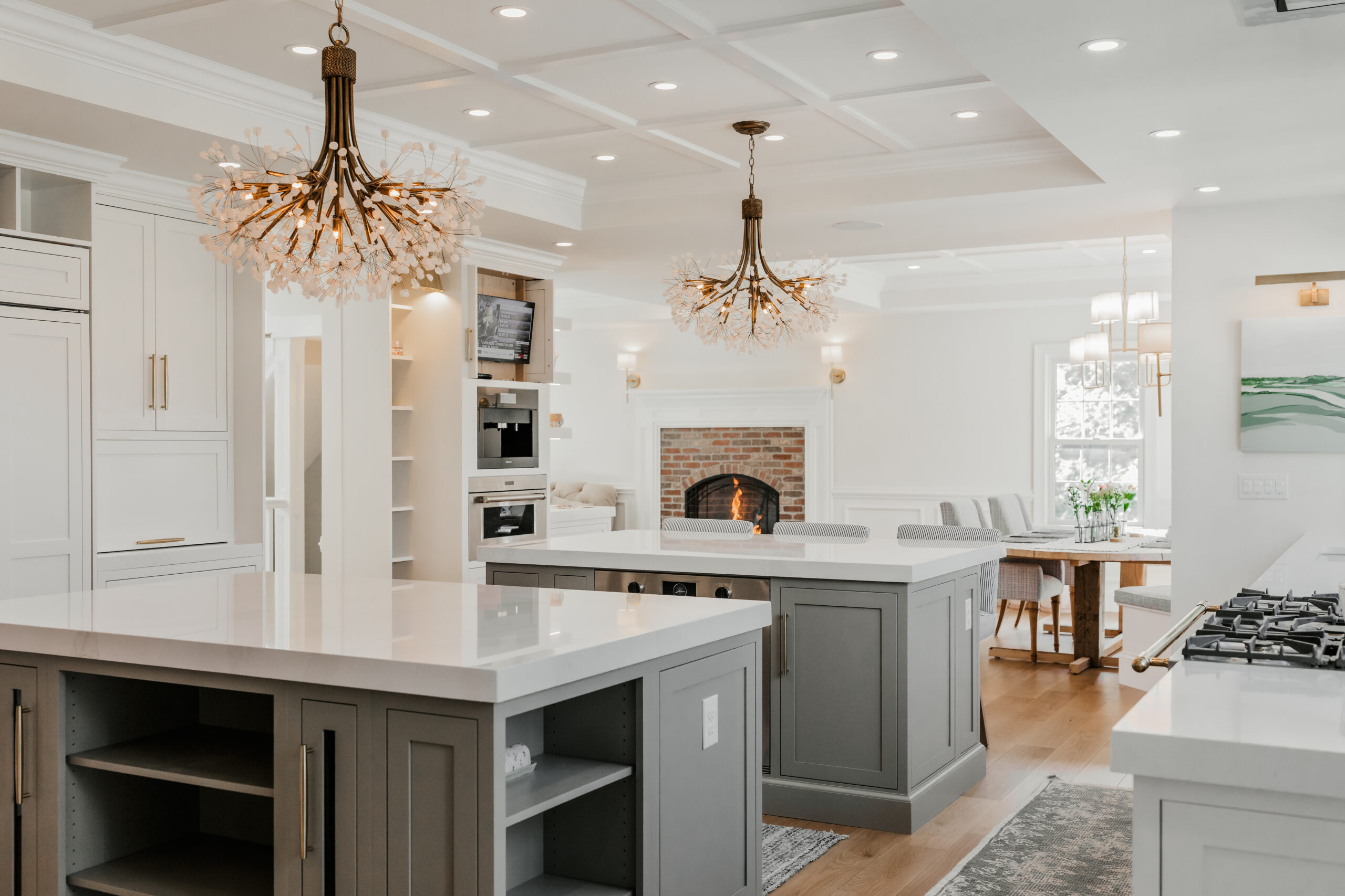 Multi room architectural design, kitchen cabinetry, architectural details, kitchen hardware, kitchen lighting, and interior design provided by Emily's Interiors