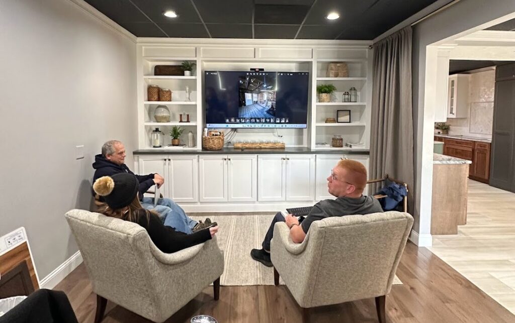 The client meeting area in our cabinet showrooms is thoughtfully equipped with a big screen TV, providing a comfortable space for customers to meet with designers and visualize their kitchen cabinet ideas in stunning detail.